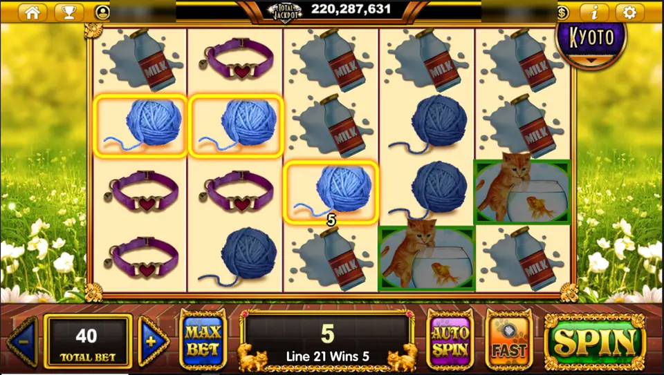Pop Kittens spin with three wool balls on line 21 paying 5, and two kitten and fishbowl symbols in green frames